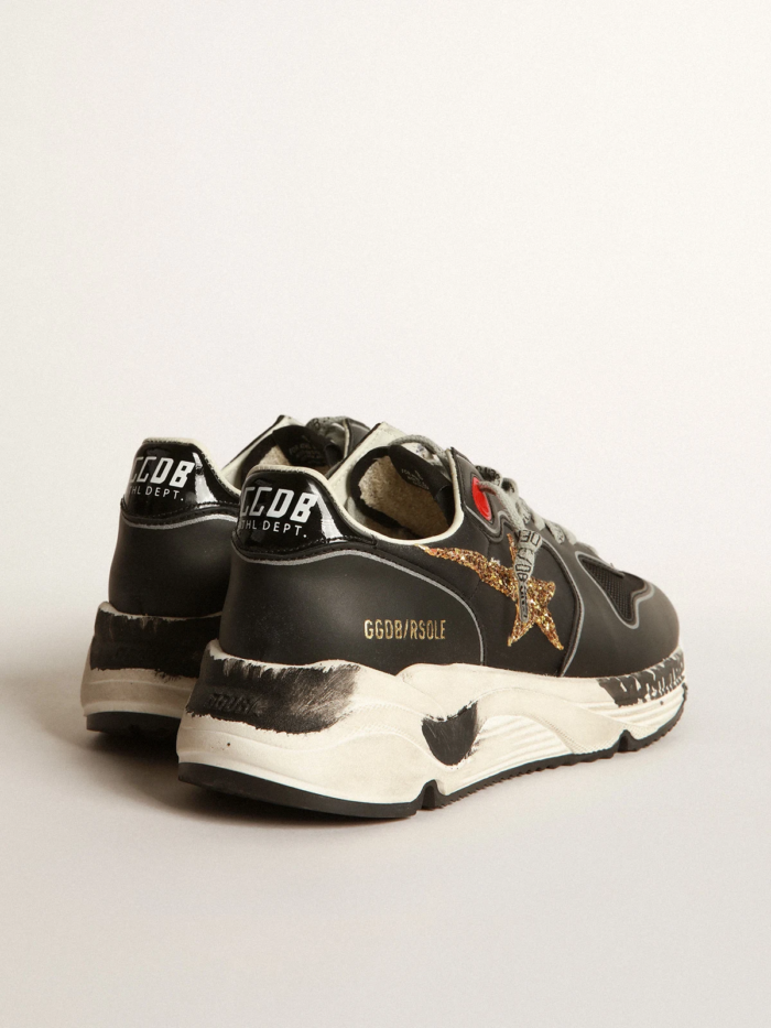 Black Running Sole sneakers with glittery gold star crossreps