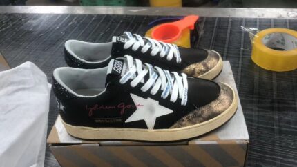 Black canvas Ball Star sneakers with platinum-colored star crossreps