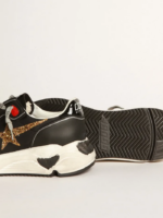 Black Running Sole sneakers with glittery gold star crossreps