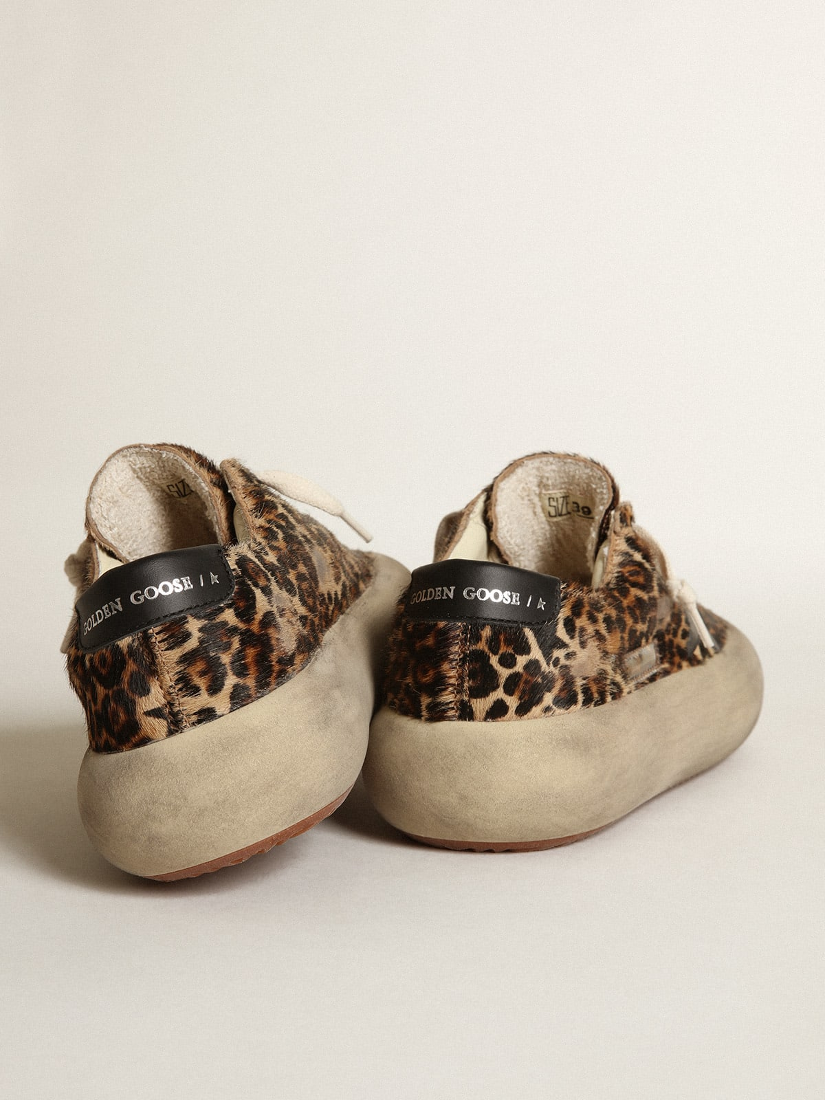 Space-Star shoes in leopard-print pony skin with black leather star and heel tab