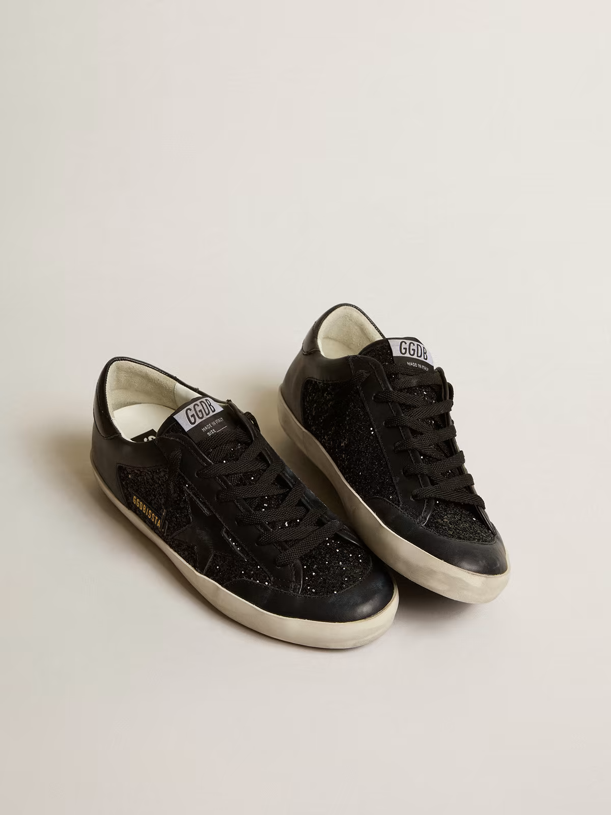 Super-Star in black nappa and glitter with glossy black leather star
