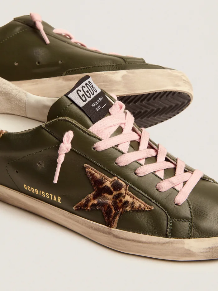 Super-Star sneakers in dark green leather with gold glitter heel tab