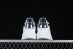 Alexander McQueen Oversized Sneaker – White Leather with Metallic Silver Heel Tab