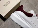 Alexander McQueen Oversized Sneakers – White with Orange Suede Heel