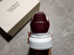 Alexander McQueen Oversized Sneakers – White with Orange Suede Heel