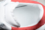 Alexander McQueen Oversized Sneakers – White with Red Suede Heel