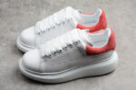 Alexander McQueen Oversized Sneakers – White with Red Suede Heel