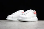 Alexander McQueen Oversized Sneakers – White with Red Suede Heel